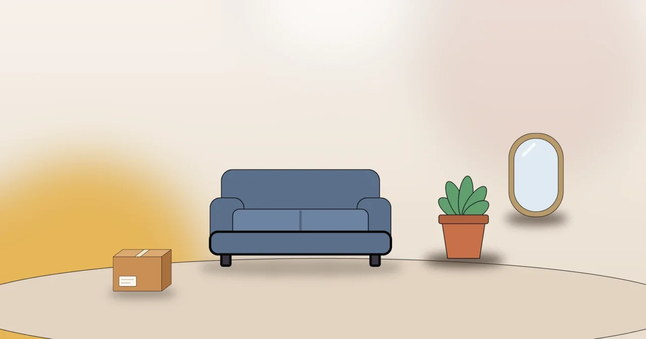 Sofa, Zimmerpflanze, Spiegel und Umzugskarton als Symbol für das gemütliche Einrichten der neuen Wohnung